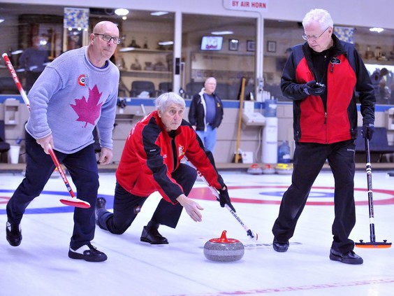 A file photograph at the Simcoe Curling Club, from 2019, shows Simcoe curler Peter Wheatley, flanked at left by teammate Denis Grasis of Port Dover and teammate Jim Simmons of Simcoe at right. Monte Sonnenberg/Postmedia SunMedia